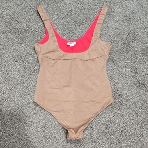Yitty Headliner Shaping Open-Bust Thong Bodysuit in the Brown Sugar colorway.